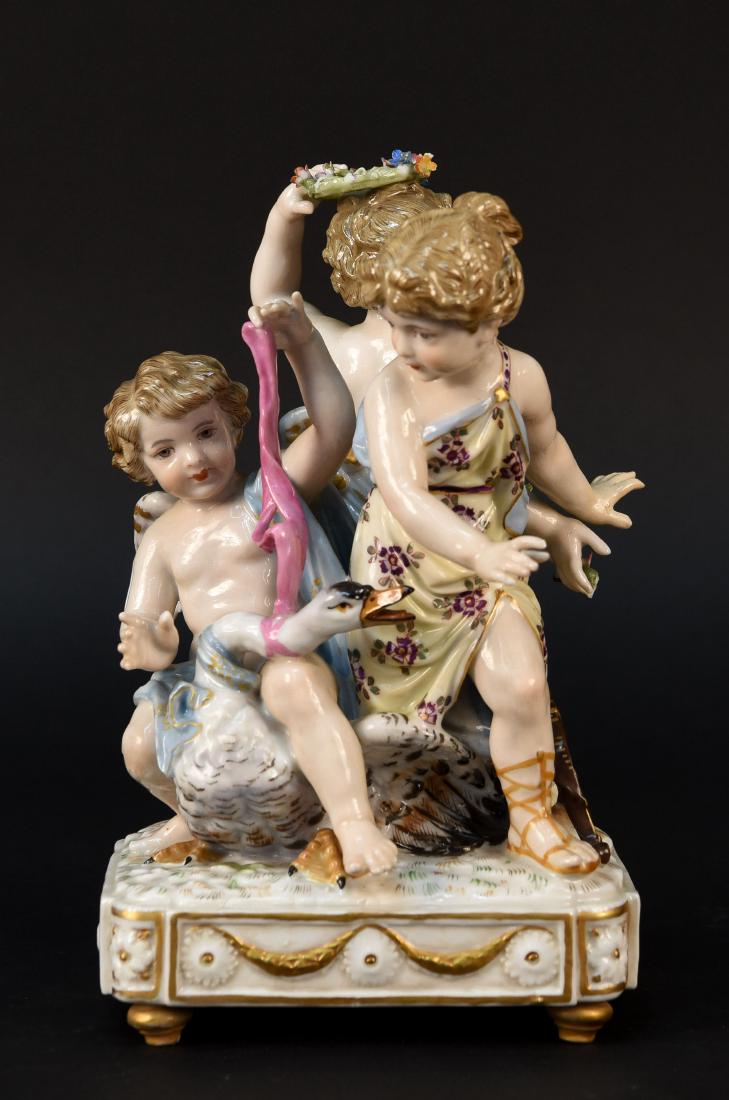 PORCELAIN FIGURE GROUP: With swirled wand marking to base. Dimensions: H 8.25" x W 5" x D 5" Condition: Few small losses to flower crown.