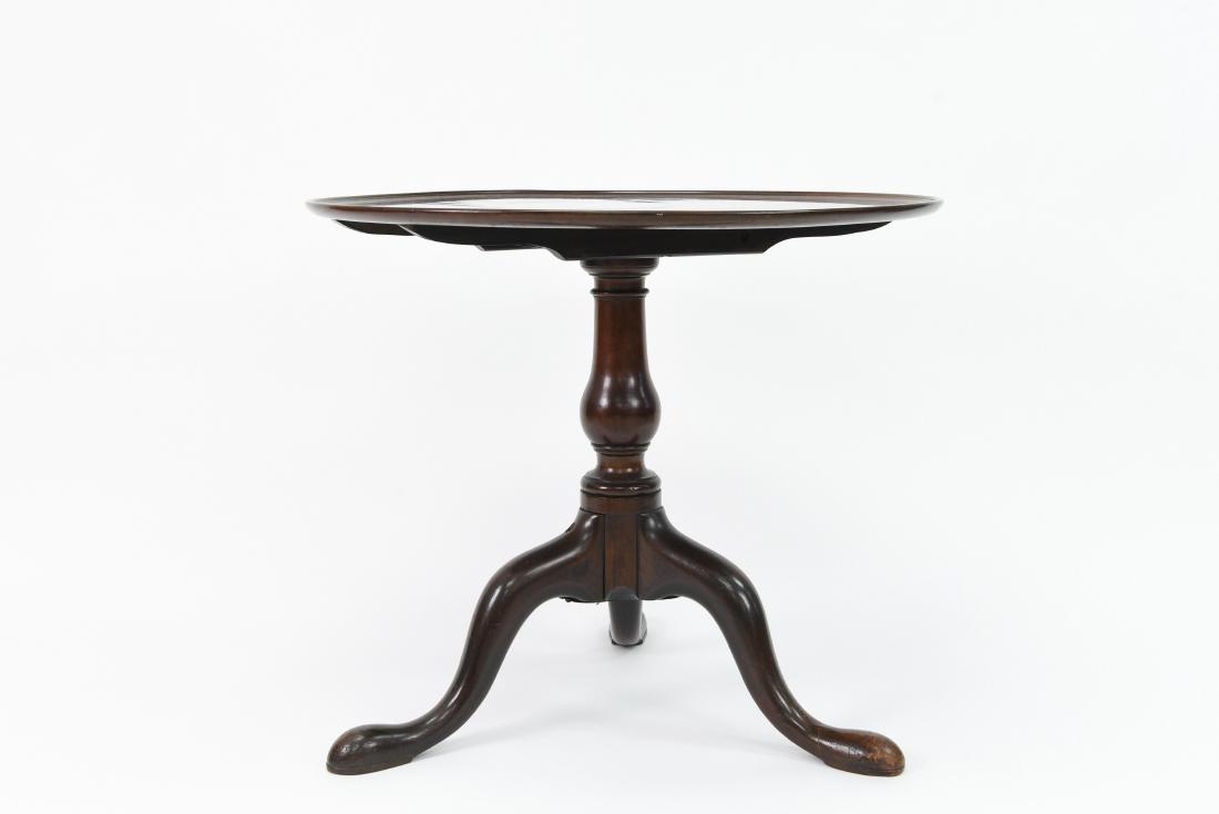 TILT TOP TEA TABLE: Dimensions: H 25" x Dia. 30" Condition: Light scratches to top. Break to one leg.
