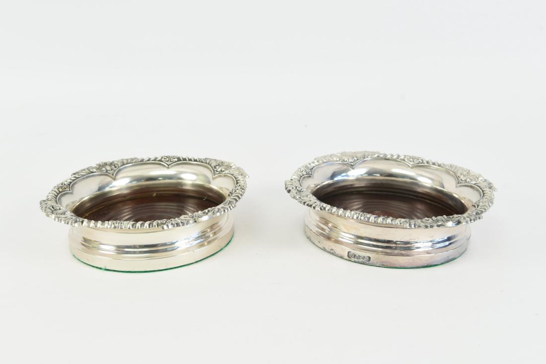 (2) SILVERPLATE WINE COASTERS: With English hallmarks. Dimensions: H 1.75" X Dia: 6.5" Condition: Normal signs of age, new felt under.