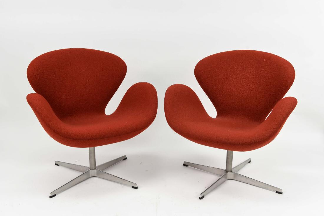PAIR OF FRITZ HANSEN KNOLL RED SWAN CHAIRS: Tagged on bottom: Fritz Hansen for Knoll. Dimensions: H 30"x W 29" x D 26" Condition: Light wear. Soiling.