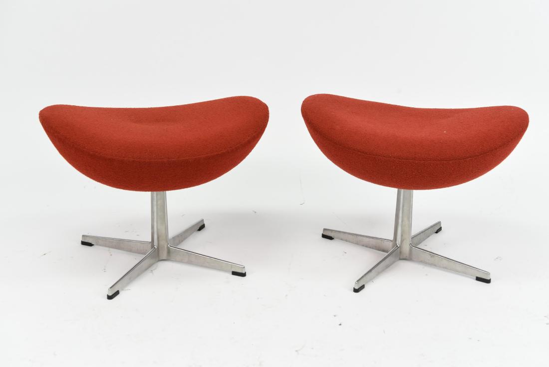 PAIR OF RED FRITZ HANSEN EGG CHAIR OTTOMANS: Dimensions: H 16" x W 22" x D 16" Condition: Light wear.