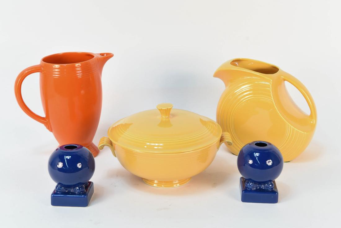 GROUPING OF FIESTA CERAMICS: (5) pieces including three marks pieces and two blue pieces not marked Fiesta. Dimensions: (Orange) H 8" x W 8.25" x D 4.5" Condition: Two small hairline fractures near mouth of yellow pitcher. Two sm