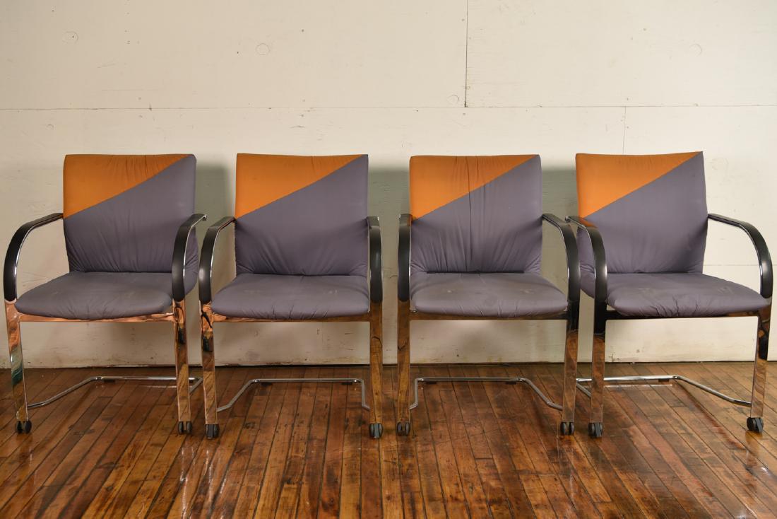 (4) FRITZ HANSEN ARMCHAIRS: Dimensions: H 32" x W 22" x D 24" Condition: Light soiling to upholstery from use, slight indentations to cushions from being stacked, small tear to upper rear of one. Y028