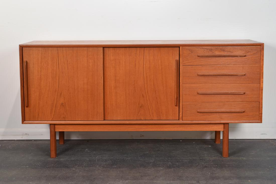 DANISH MID-CENTURY TEAK SIDEBOARD: Dimensions: H 29.25" x W 60.25" x D 17" Condition: Very mild finish wear and few light scuffs to top.