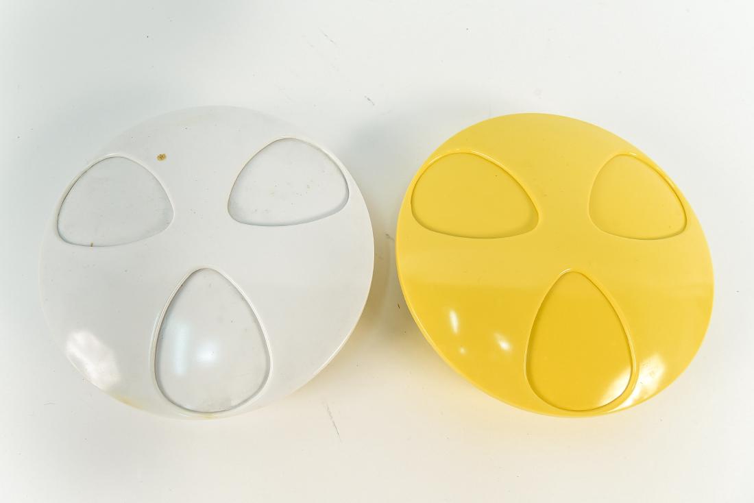 (2) H. J. STOTTER SPACE AGE MELAMINE ASH TRAYS: Marked underneath. c. 1970's. With rotating lid to close holes. Dimensions: H 2.5" x Dia. 8.25" Condition: Yellowing to side of white one. Wear consistent with age and use.