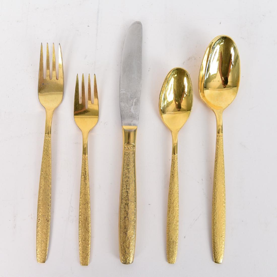 GOLD TONE FLATWARE: Service for 12, Marked: VS . Dimensions: L 9.75" (serving spoon) Condition: Wear consistent with use. Missing one small fork. 25 tea spoons.