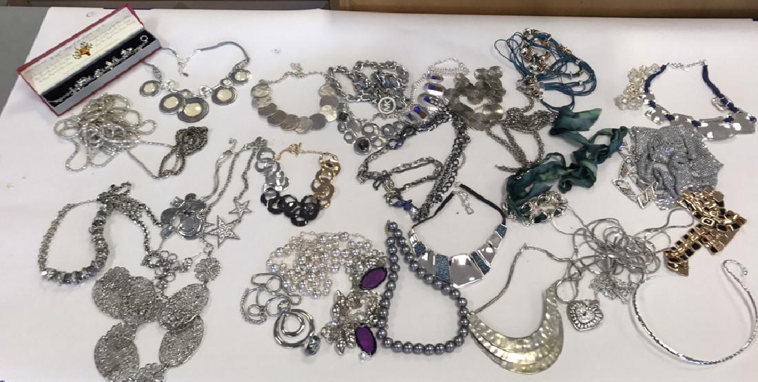 GROUPING OF SILVER TONE COSTUME NECKLACES: 32 pieces including Michael Kors. Contemporary. Condition: All wearable.