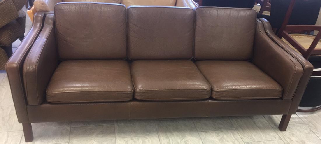 3-SEAT BORGE MOGENSEN STYLE SOFA BY MOGENS HANSEN: Dimensions: H 30" x W 74.5" x D 31" Condition: One small puncture in leather on side of sofa. Brown leather.