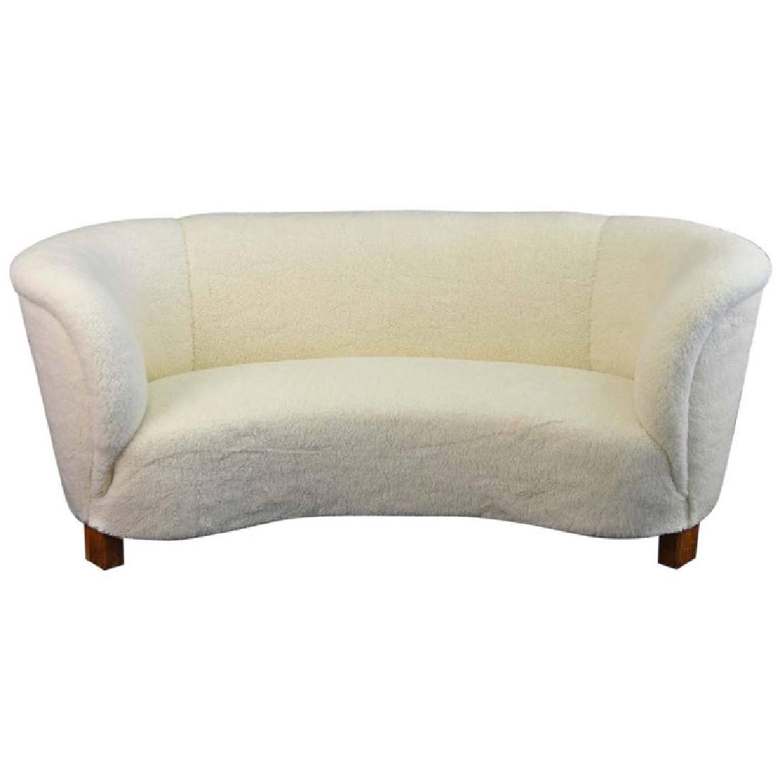 1940'S DANISH BANANA SOFA BY SLAGELSE MOBELVAERK: Early 1940s Danish Banana sofa in the manner of architect Flemming Lassen, newly reupholstered in genuine lambs wool. Dimensions: H 30" x W 75" x D 40" Condition: Excellent. Upholstery is in excellent