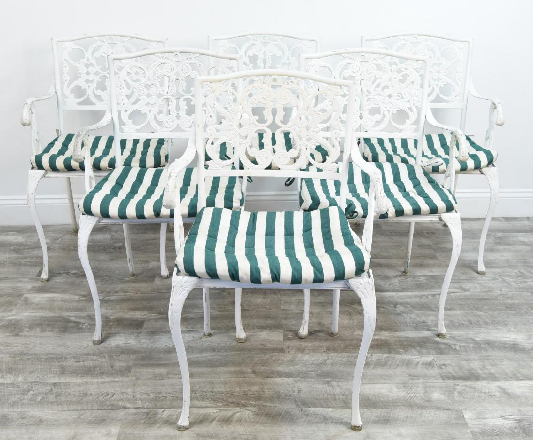 IRON OUTDOOR TABLE AND SIX CHAIRS WHITE: Purchased from Doyle auction several years ago. Dimensions:(table) H 30" x DIA. 40", (chair) H 33" x W 22" x D 19" Condition: Some rust and paint loss.