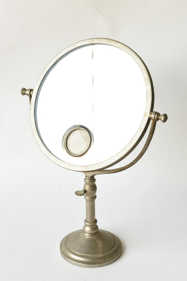 ART DECO FRENCH VANITY OR SHAVING MIRROR: Marked: Le Mirophar Brot, Depose Dimensions: H 16.5" x 11.75" x D 4.5" Condition: Needs to be rewired (light fixture cord has been cut). Finish wear to metal. Some crazing to the mirrors silvering alo