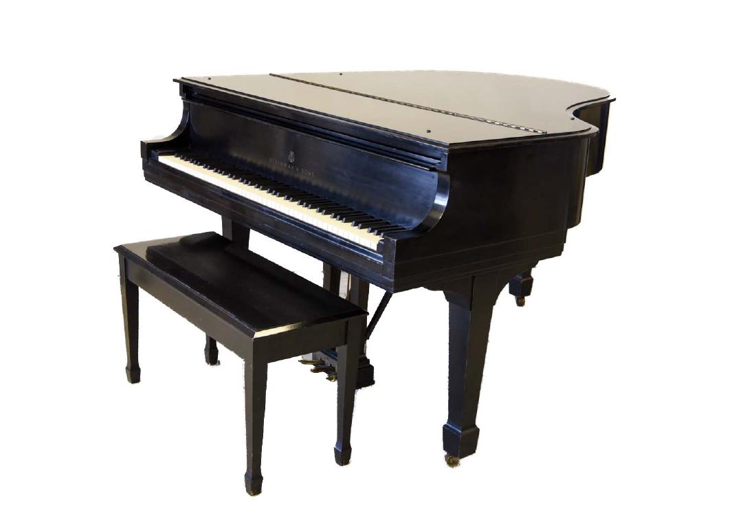 STEINWAY MODEL M EBONY GRAND PIANO: Model M. Serial Number - 422704. C. 1970/1971. Belonged to opera star Luben Vichey. All tuning done by a Steinway professional. Dimensions: (Closed) H 37.75" x W 56.75" x D 64" Condition: Nicks, dings