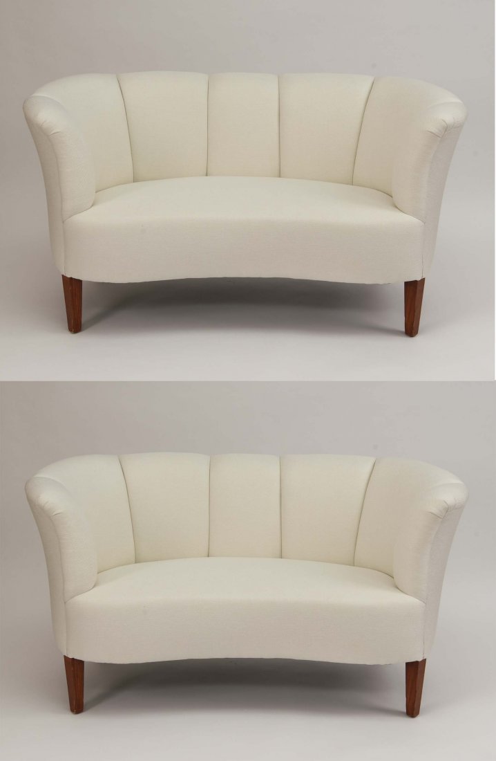 PAIR OF WHITE MID-CENTURY KIDNEY SHAPED SETTEES: Newly upholstered. Dimensions: H 30" x W 58" x D 32" Condition: A couple of very light streaks to back of one.
