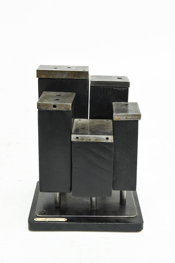 CARL RAPOPORT SCULPTURE: Wood, steel. Brass name plate attached. Dimensions: H 12" x W 9" x D 7" Condition: Losses to wood filler over screws on the sides.