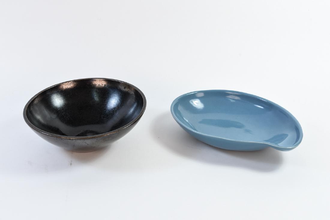 (2) EVA ZEISEL BOWLS: Dimensions: H 3" x D 8.75" (metallic glaze) Condition: Couple light scratches and rubs to crackled metallic glazed bowl. Few small chips to underside of blue bowl- possibly from manufacturing.