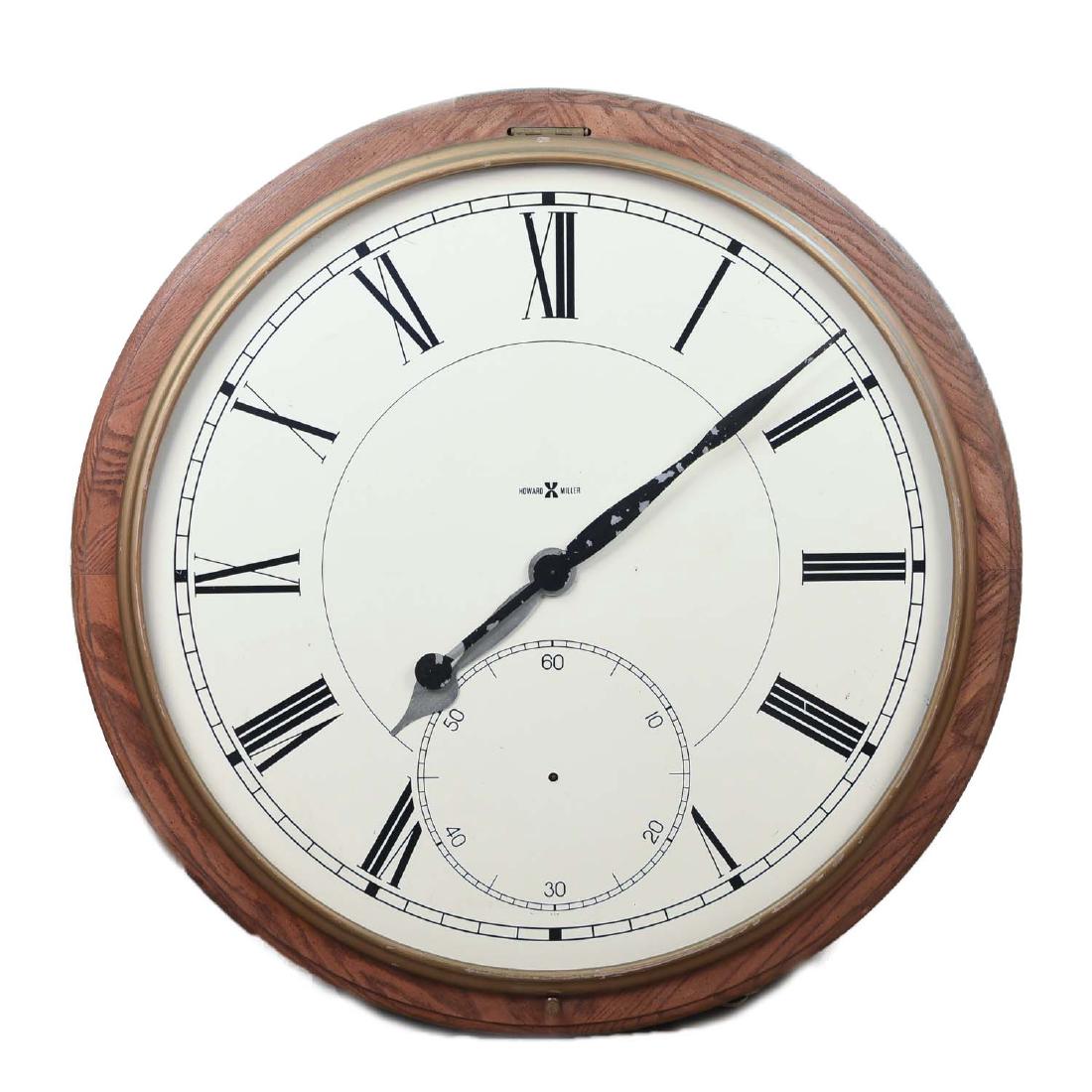 LARGE HOWARD MILLER ELECTRIC CLOCK: Dimensions: DIA 42" Condition: Not tested, missing glass, missing second hand, surface dirt and marks to wood.