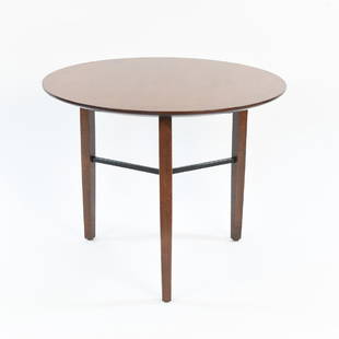 LEWIS BUTLER FOR KNOLL 3 LEG SIDE TABLE: Cherry wood, with metal stretcher. Dimensions: H 19" x Dia. 24" Condition: Light surface wear to top, light dents and dings to legs.