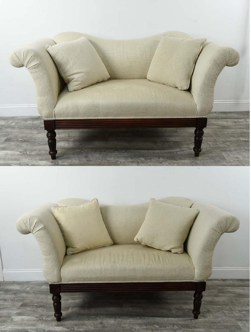 PAIR OF LILLIAN AUGUST SETTEES: Dimensions: H 33.5" x W 63" x D 29" Condition: Showing signs of use. Soiling. Some small stains to upholstery. Light wear to legs.