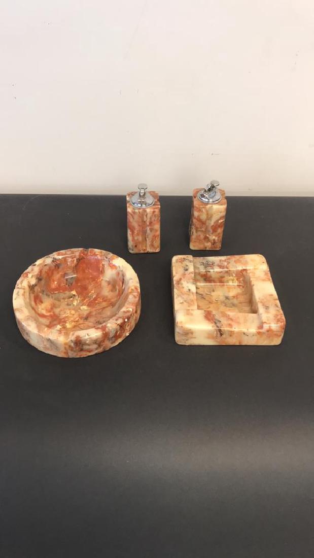 ALABASTER TABLE LIGHTER AND ASHTRAY GROUPING: (4) pieces.Dimensions: (Circular ashtray) H 2" x Dia. 8.25"Condition: Showing light signs of use. Couple very small chips to bottom edges.
