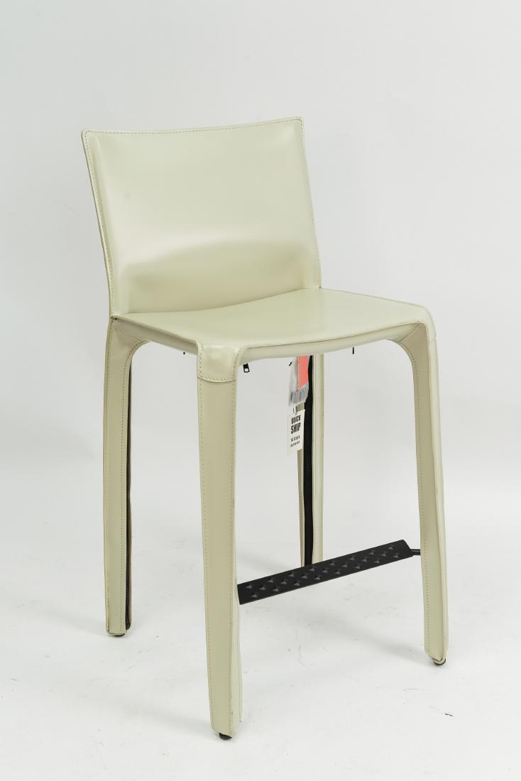 410 CAB CHAIR BY MARIO BELLINI FOR CASSINA: Leather, painted steel, and polyeurathane foam. Marked Cassina under seat. Cassina tag and bag of foot caps attached. Dimensions: H 39.5" x W 18.5" x D 18" Condition: Showing very light signs of use.