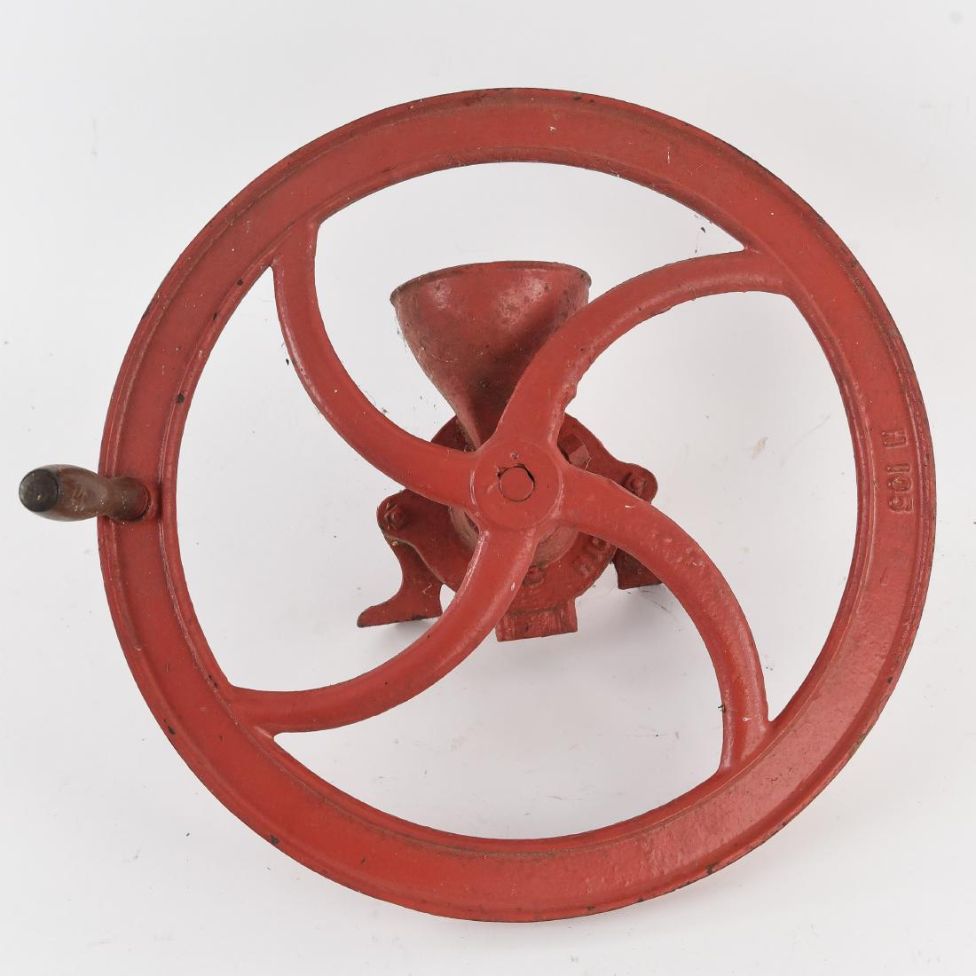 CAST IRON GRINDER: Dimensions: H 15" x D 18.5" Condition: Wear consistant with age