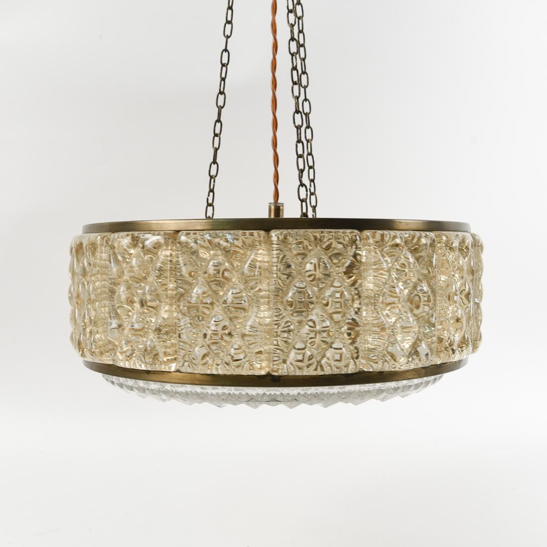 CRYSTAL AND BRASS CHANDELIER BY ORREFORS: C. 1970's. Dimensions: H 6.25" x Dia. 14.25" Condition: Some discoloration on brass.