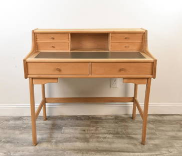 DANISH MODEL 50 DESK BY ANDREAS HANSEN: Inset leather writing top and beech wood frame.Dimensions: H 37.75" x W 41.5" x D 23.5"Condition: Good vintage condition, some fading to the wood surface. Presents nicely. Writing surface height is 30