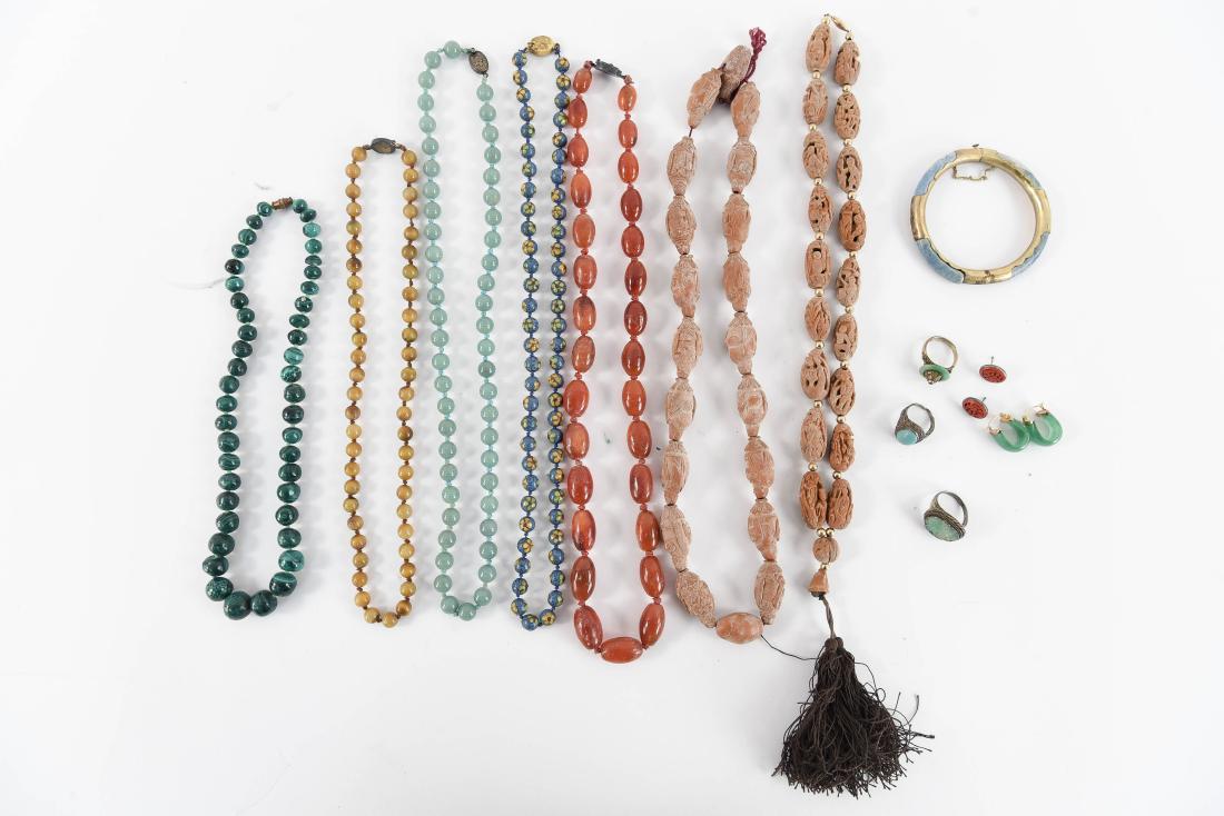 GROUPING OF ASIAN STYLE STONE JEWELRY: Including malachite, carnelian, cloisonne, etc. Condition: Showing signs of age, in need of cleaning.