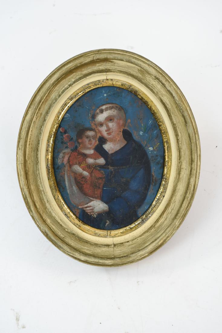 19TH C MEXICAN RETABLO ON TIN: Depicting St. Francis with Christ Dimensions: (Frame) H 13" x W 11", (Sight) H 8.75" x W 6.75" Condition: Tin cut to fit oval, Some surface losses.