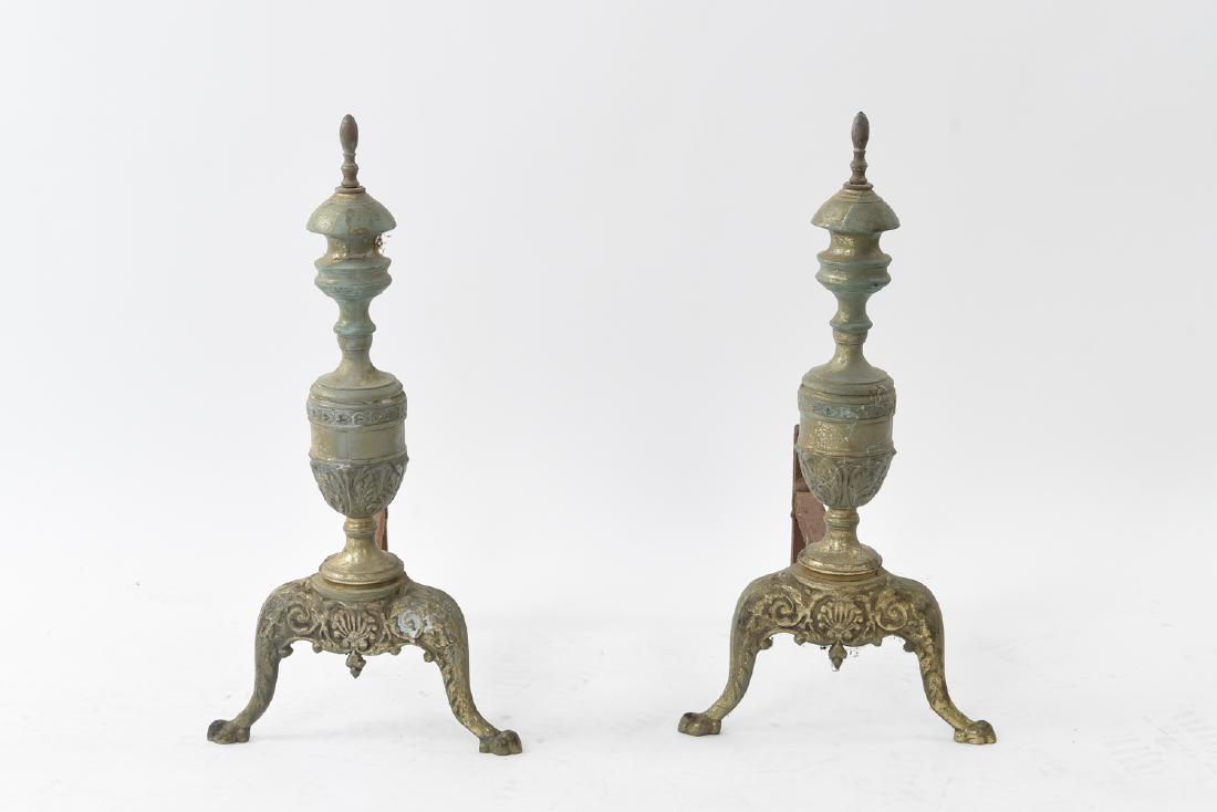 PAIR OF BRASS ANDIRONS: Dimensions: H 21.75" x W 11" x D 12" Condition: Oxidation throughout. Wear consistent with age and use.