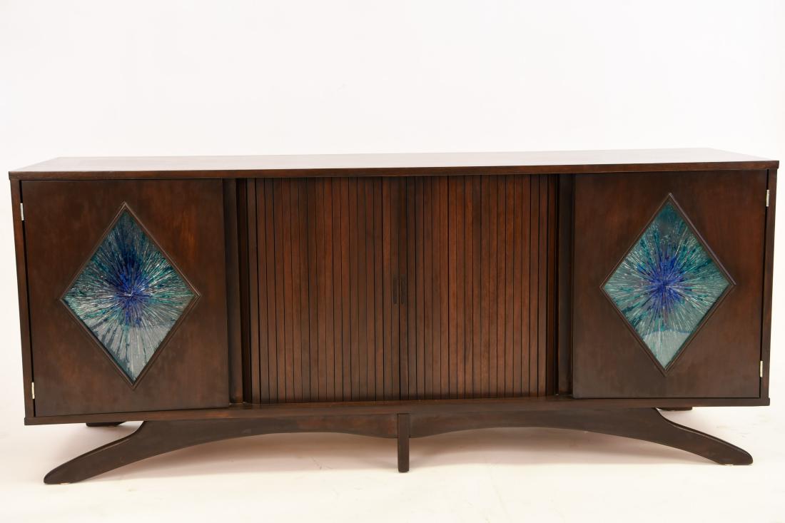 MID-CENTURY SCULPTURAL STAINED GLASS CREDENZA: Dimensions: H 30.25" x W 72" x D 20" Condition: Showing very light signs of use. Small repair (.5" x .75") to back right side corner edge of veneer.