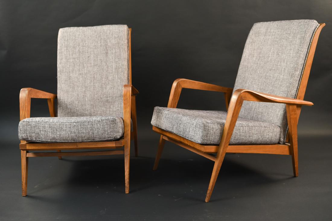 PAIR OF MID-CENTURY FRENCH RECLINING CHAIRS: France 1950's, Oak . Dimensions: H 33" x W 25" x D 27" Condition: Few surface scratches, nicks, and dings to wood.