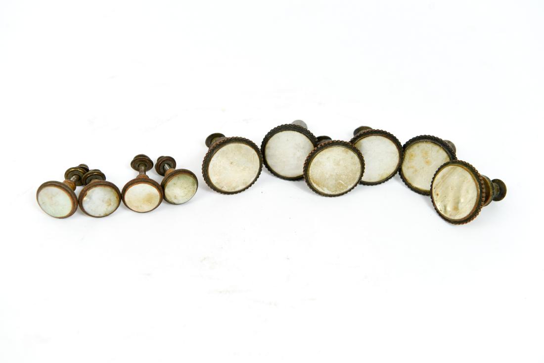 BRASS AND INLAID MOTHER OF PEARL KNOBS: (10) pieces. Dimensions: (Larger) H 2" x Dia. 1.5" Condition: Showing signs of age. Some rusting. Scratches and scuffs to mother of pearl.