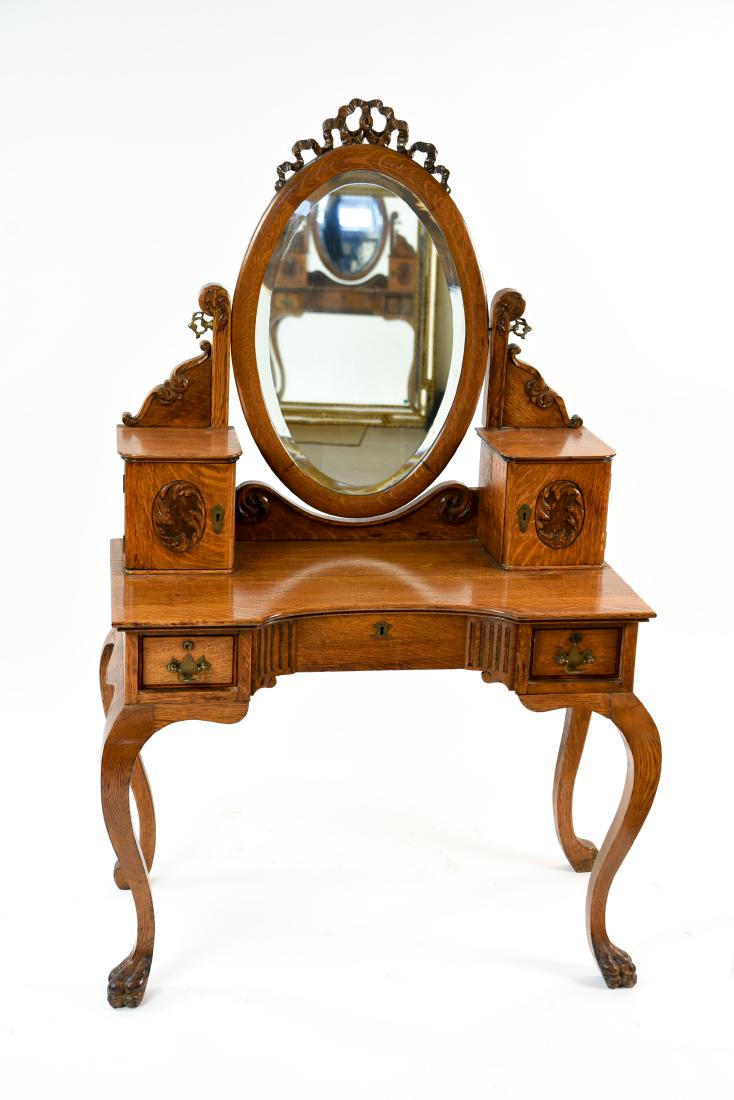 VICTORIAN CARVED OAK VANITY/DESK: Dimensions: H 59.75" x W 37.5" x D 18.5" Condition: Old repair to top crest ribbon. Some separations at joints. Wear consistent with age and use.