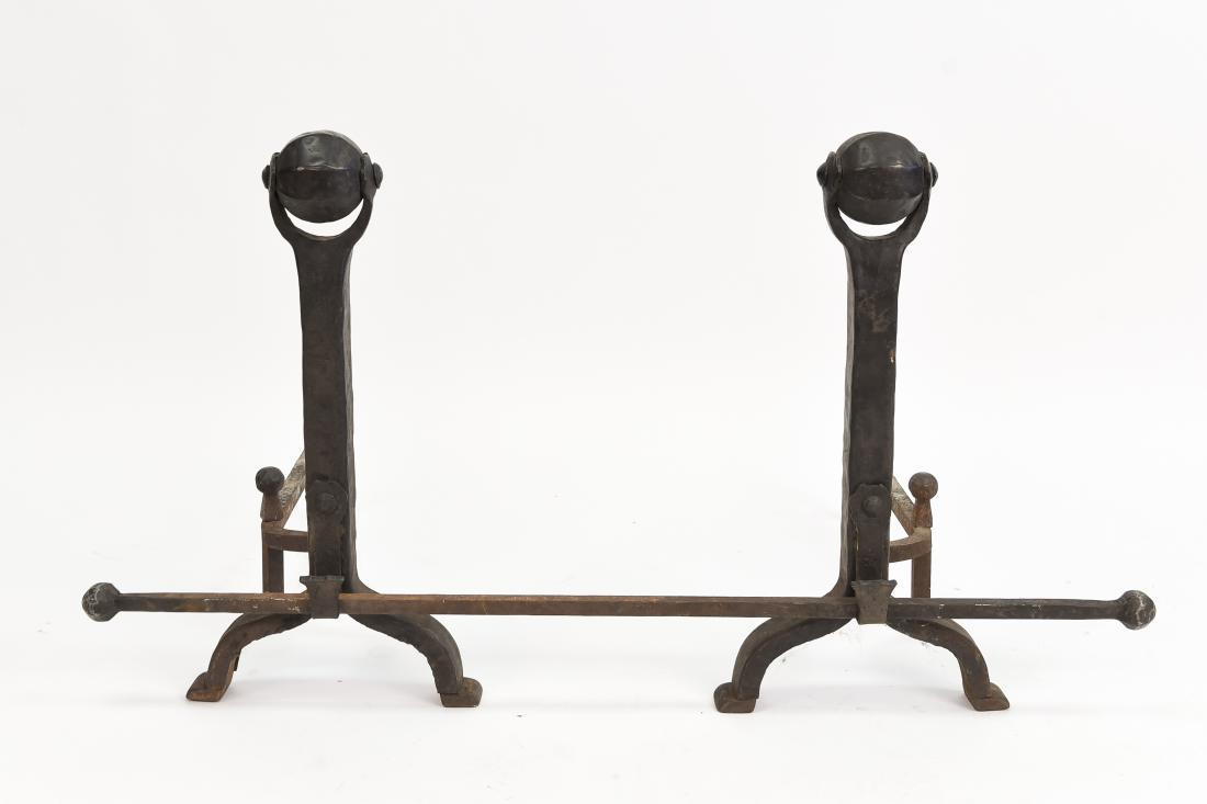 PAIR OF BRUTALIST ANDIRONS: Dimensions: (Each side) H 22.25" x W 11.5" x D 23.75", (Bar) L 41" Condition: Some rust and oxidation. Showing signs of use.
