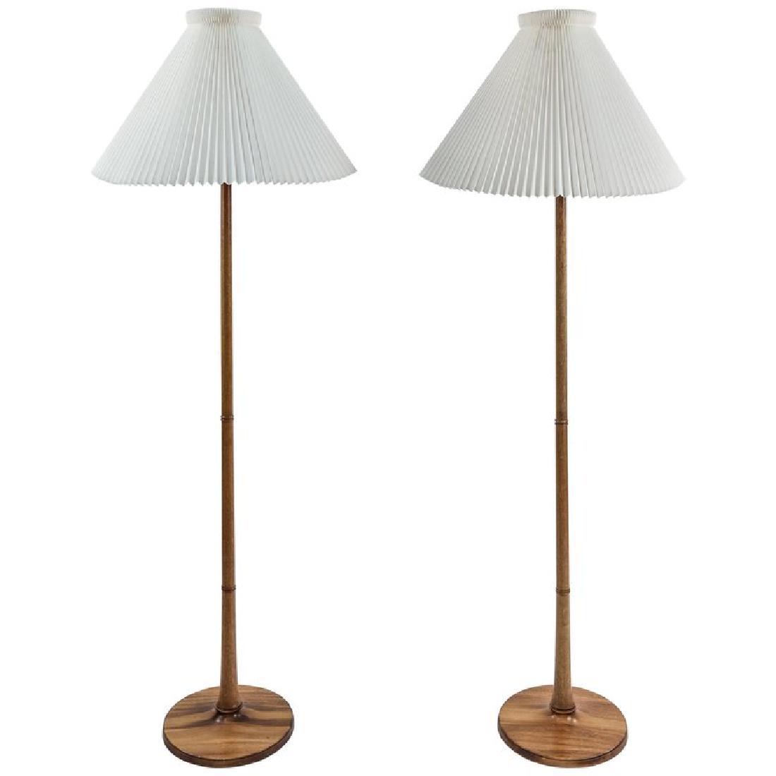 PAIR OF ESBEN KLINT LE KLINT FLOOR LAMPS: Danish, c. 1970's. Mahogany. Dimensions: H 65" x Dia. 12" Condition: The shades have some bends in them, some light scratches. WPB247