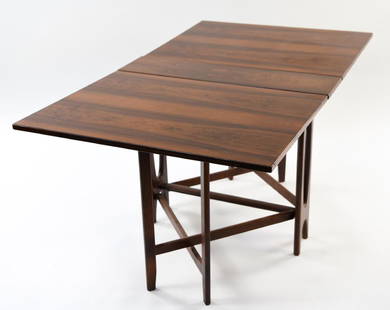 BENDT WINGE DROP-LEAF ROSEWOOD TABLE C. 1960: Norwegian, mid-century. Dimensions: H 29" x W 8" x D 34" (W=58 fully extended) Condition: Some light surface scratches. H WPC061