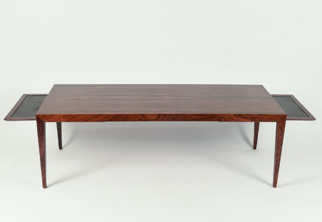 SEVERIN HANSEN FOR HASLEV EXTENDABLE COFFEE TABLE: Rosewood. Dimensions: H 20" x W 59" x D 23.5" Condition: Wear consistent with age and use. WPA040