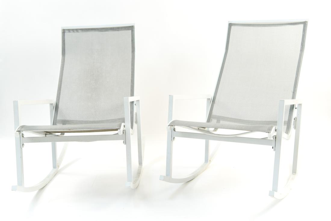 PAIR OF OUTDOOR PATIO ROCKING CHAIRS: Dimensions: H 36" x W 40" x D 23.25" Condition: Wear consistent with outdoor exposure.