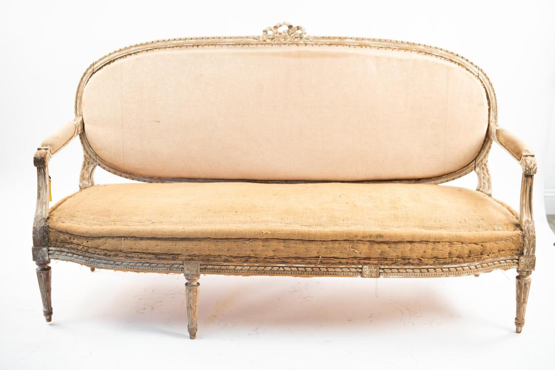 FRENCH LOUIS XVI STYLE OVAL BACK SETTEE: Dimensions: H 42" x W 72" x D 23" Condition: As is. No upholstery, soiling and tears to lining. Paint wear. Missing one front leg.