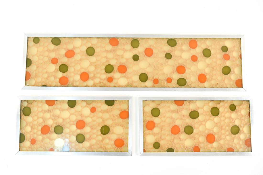 SET OF 3 MID CENTURY RESIN CIRCLE WALL PANELS: Panels of multi colored semi translucent resin. Dimensions: (Largest) H 12.25" x W 48" Condition: Surface scratches, frame corner separation.