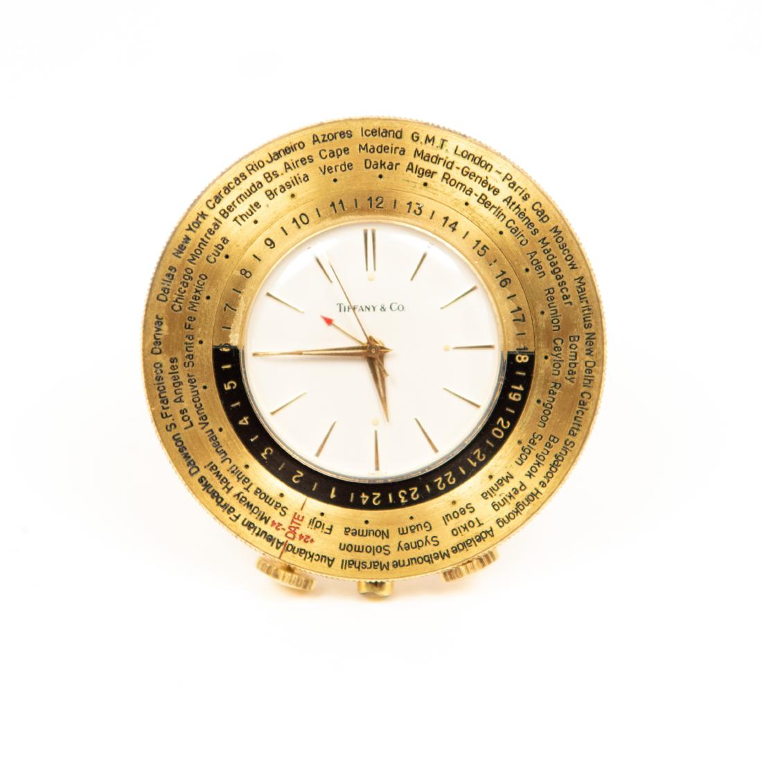 TIFFANY AND CO TRAVEL CLOCK: Marked Luxor S.A. Swiss on back. Dimensions: Dia. 2.25" Condition: Not tested.