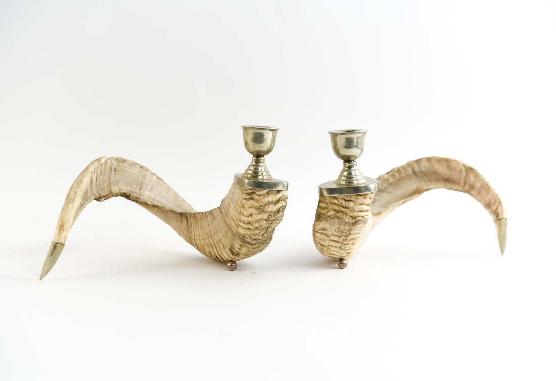 SILVER MOUNTED RAM HORN CANDLE HOLDERS: Stamped with numbers on the tips, most likely silverplate. Dimensions: H 8" x W 12" x D 8" Conditions: No issues to note.