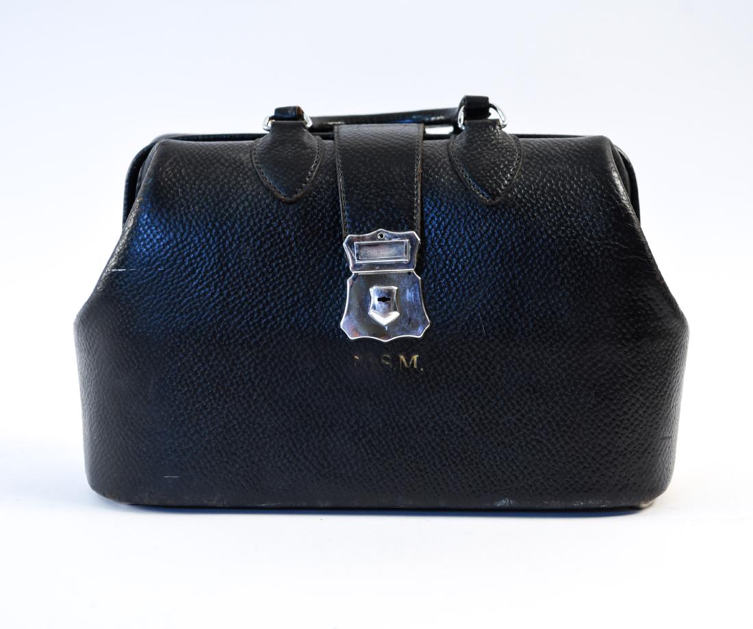 VINTAGE LEATHER MEDICAL DOCTORS BAG: Monogrammed M.S.M. Dimensions: H 9" x W 14.5" x D 6" Condition: Some scuffs and wear from age and use.