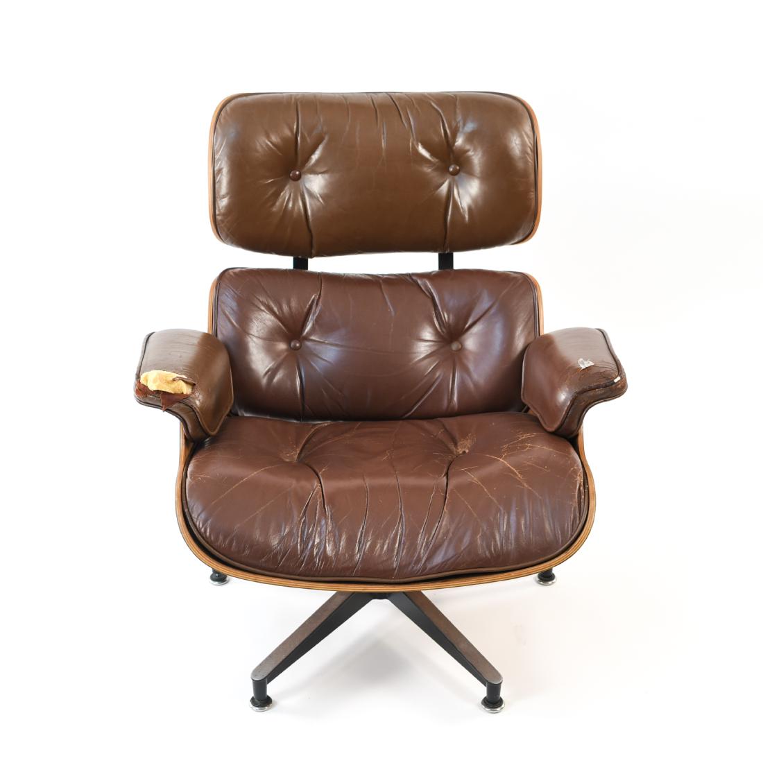 VINTAGE EAMES HERMAN MILLER LOUNGE CHAIR: Tagged Herman Miller under seat. Brown leather. Dimensions: H 32" x W 32" x D 32" Condition: Frame/base showing light wear consistent with age and use. Creasing and areas of heavy wear to upholstery. 