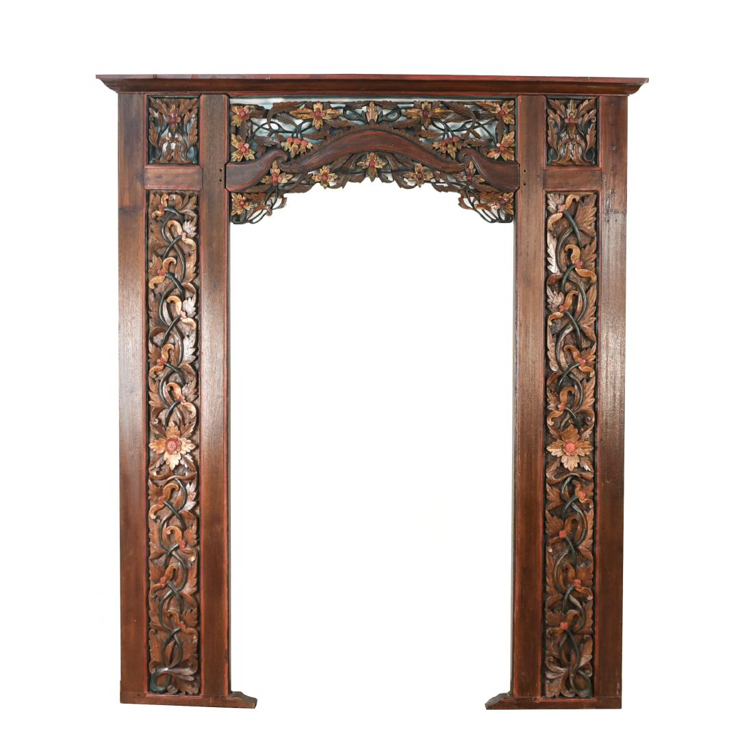 INDONESIAN CARVED AND PAINTED ARCH DOORWAY: Dimensions: H 90.25" x W 76" x D 6" Condition: Surface wear, nicks, and dings.