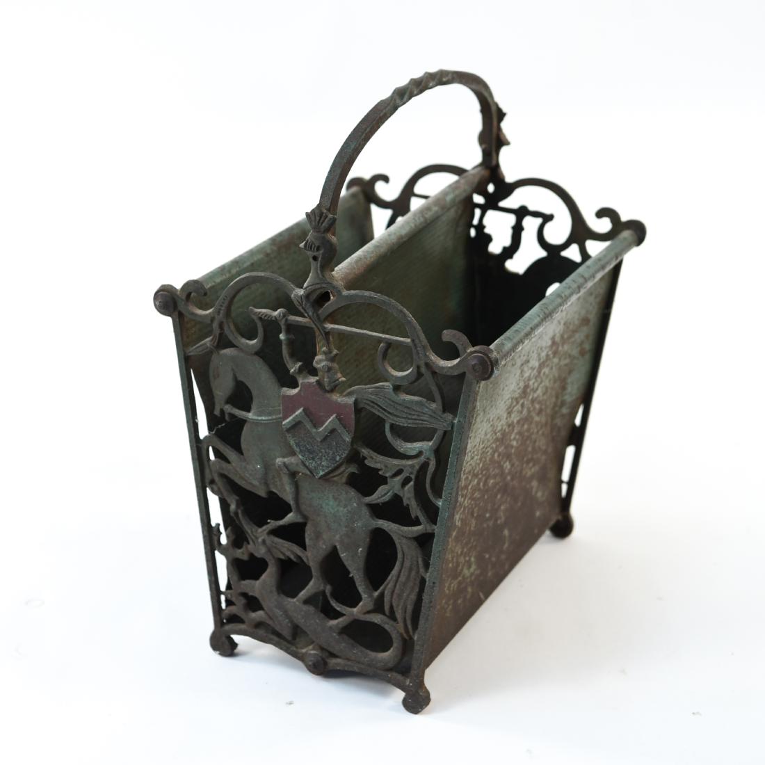 MANNER OF OSCAR BACH MAGAZINE RACK, C.1920's: Dimensions: H 15.75" x W 12.75" x D 10" Condition: Showing wear consistent with age and use. Paint finish loss and rust.