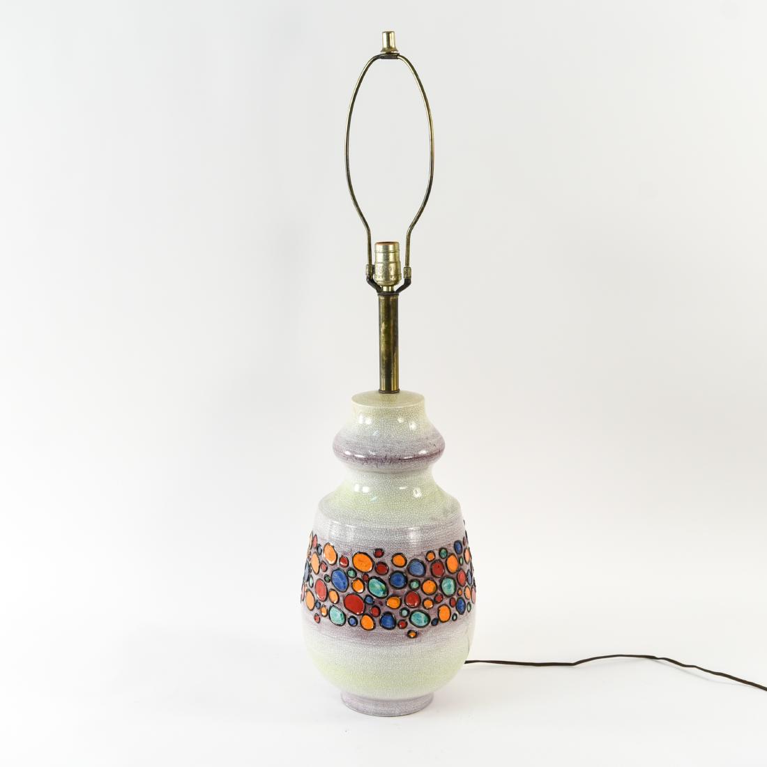 1960S RAYMOR ITALIAN CERAMIC TABLE LAMP: Raymor Italy. 1960s. Dimensions: H (to socket) 25" x Dia. 10" Condition: Intentionally crazed glaze. Showing some small losses of glaze on black borders of colored pattern. Functional.