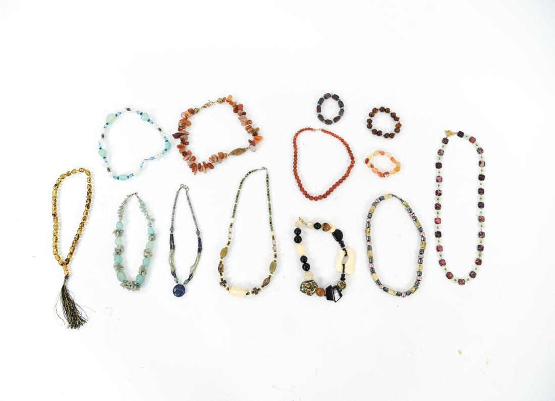 GROUPING OF BEADED JEWELRY: Includes (10) necklaces and (3) bracelets. Condition: Used, wearable.