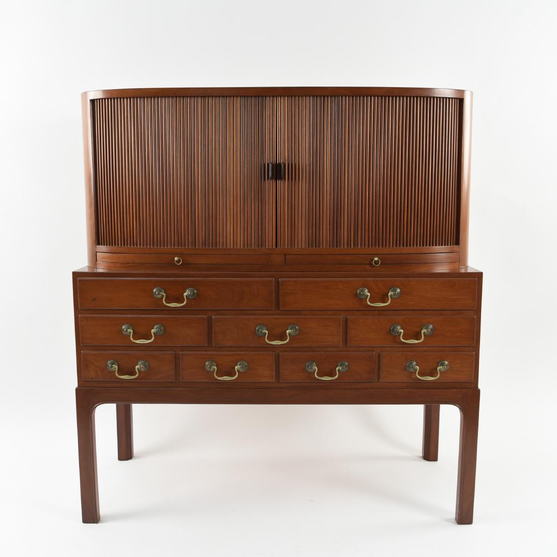 DANISH SIDEBOARD BY JACOB KJAER: A beautiful mahogany sideboard with handmade brass pulls designed by the Notable Master Craftsman and Designer Jacob Kjaer (1896-1957) Dimensions: H 47.5" x W 44" x D 19" Condition: Water ring mark on